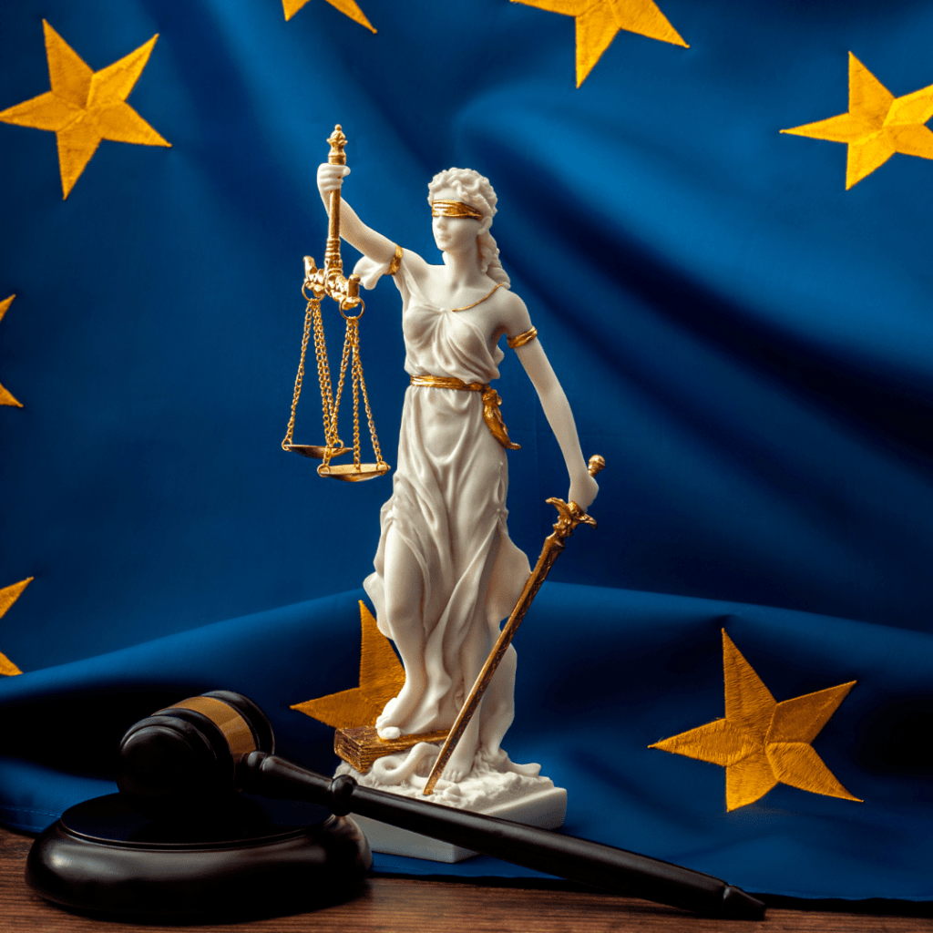 Lady Justice statue with scales and sword, set against the European Union flag, symbolizing legal rulings in transfer pricing cases.