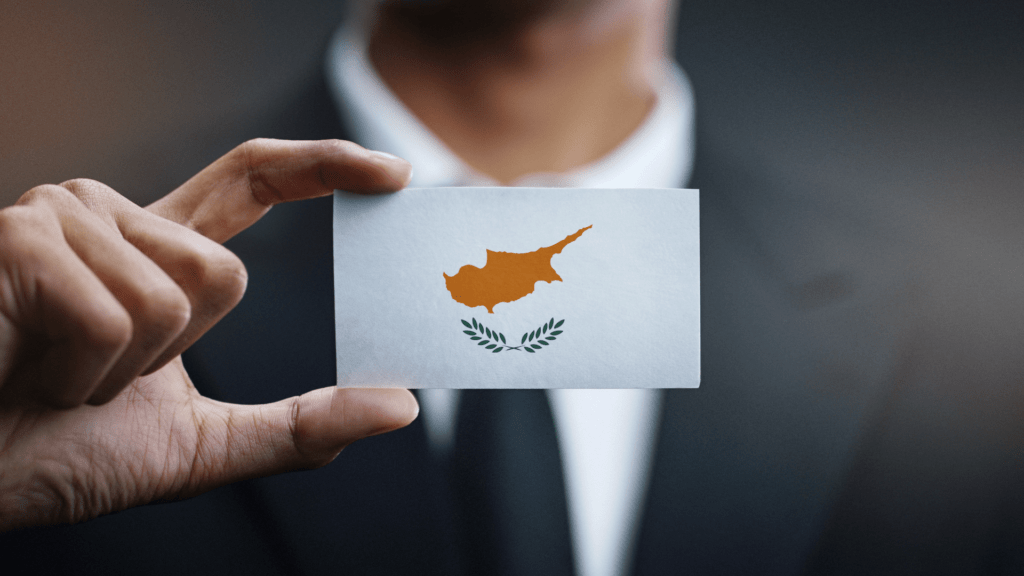 Illustration of the Cyprus flag with a yellow map of Cyprus and green olive branches enclosed in a circular design