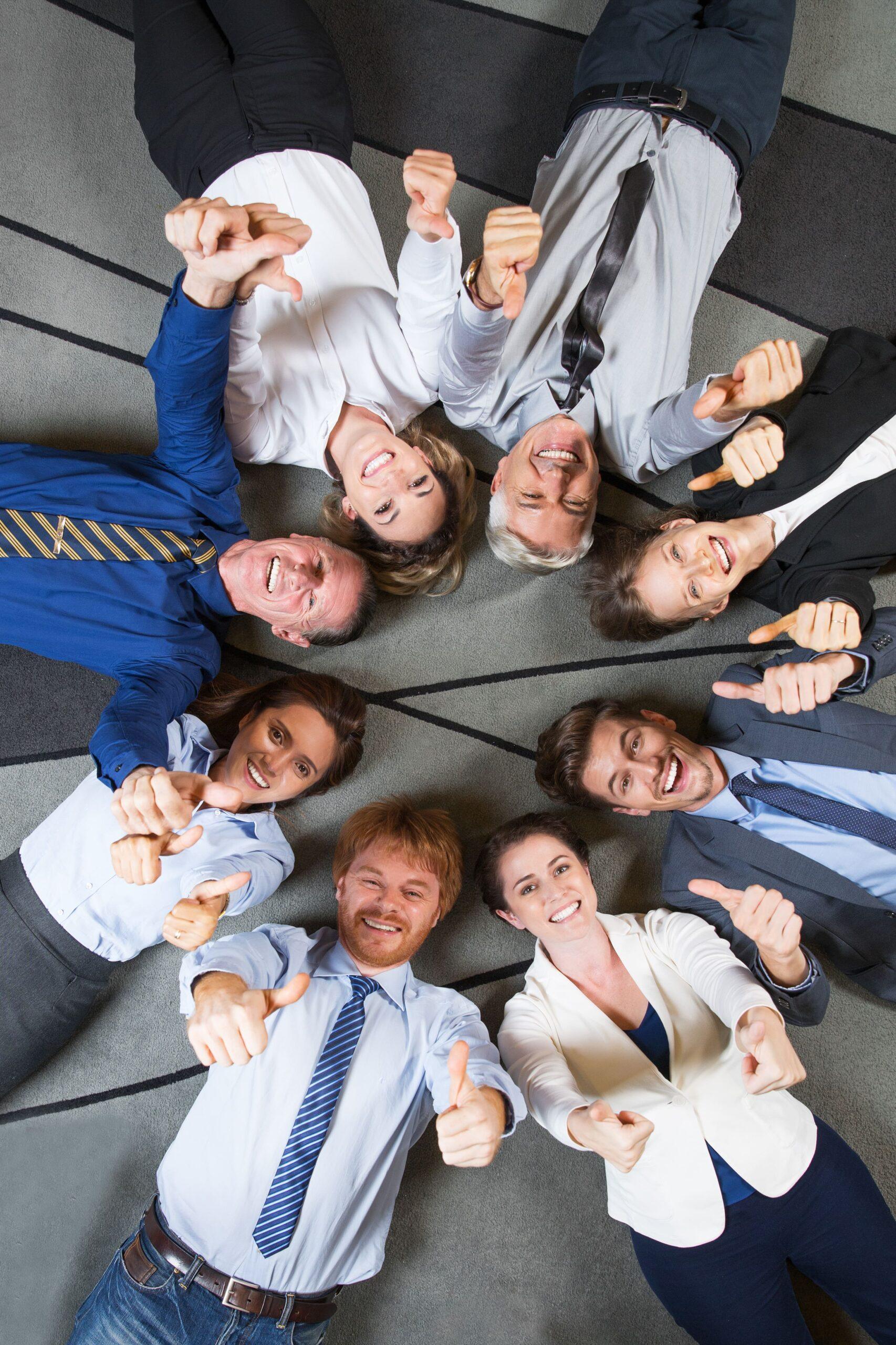 Smiling businessmen extending their hands for a handshake in a modern office, symbolizing confidence in meeting transfer pricing documentation requirements.